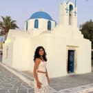Portrait of Aashi Shah in a white top and skirt in Greece